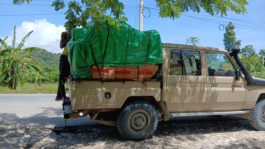 Pickup truck loaded and secured for a field delivery